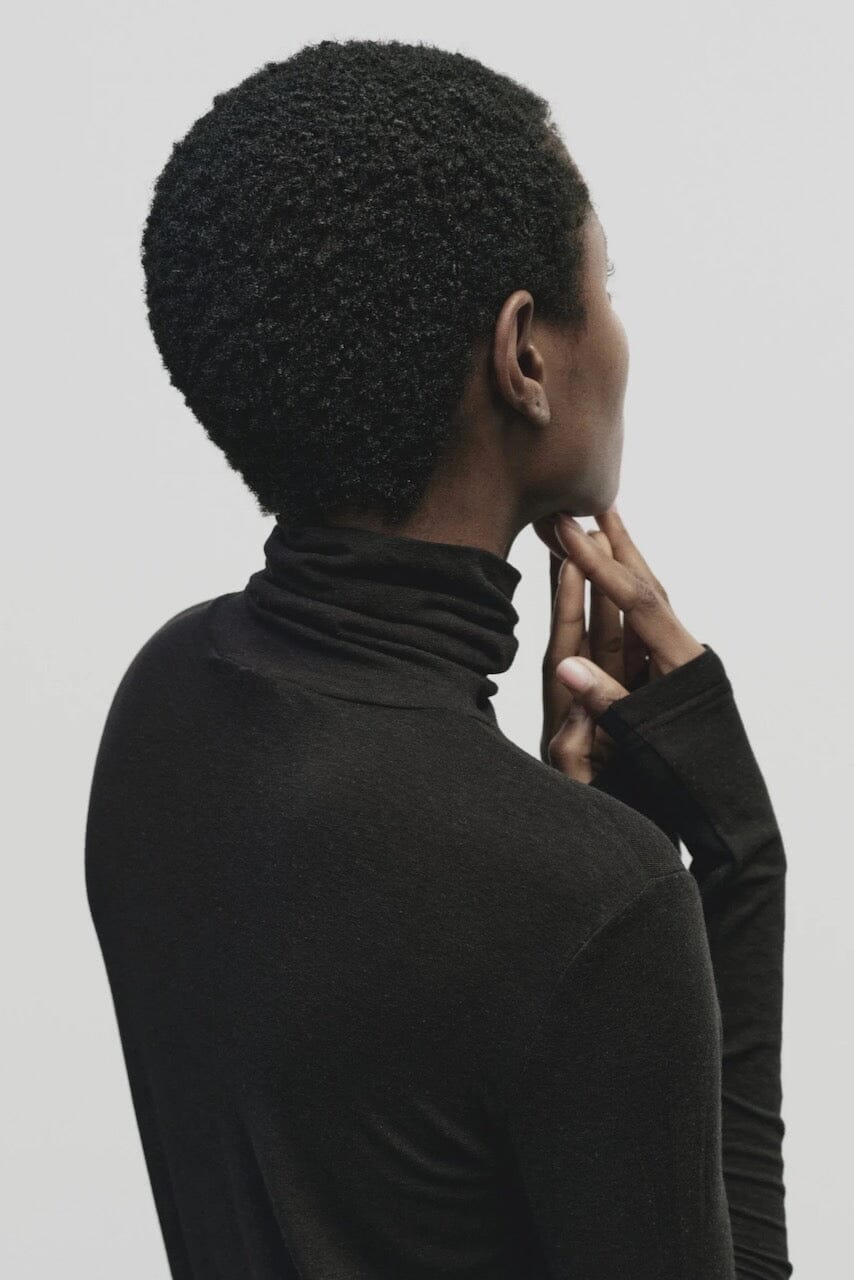 Black slim fit Tencel cotton roll neck top by Mijeong Park