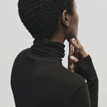 Black slim fit Tencel cotton roll neck top by Mijeong Park