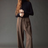 Front view of the dark navy roll neck jersey top at SHOP YUCCA in Denver.