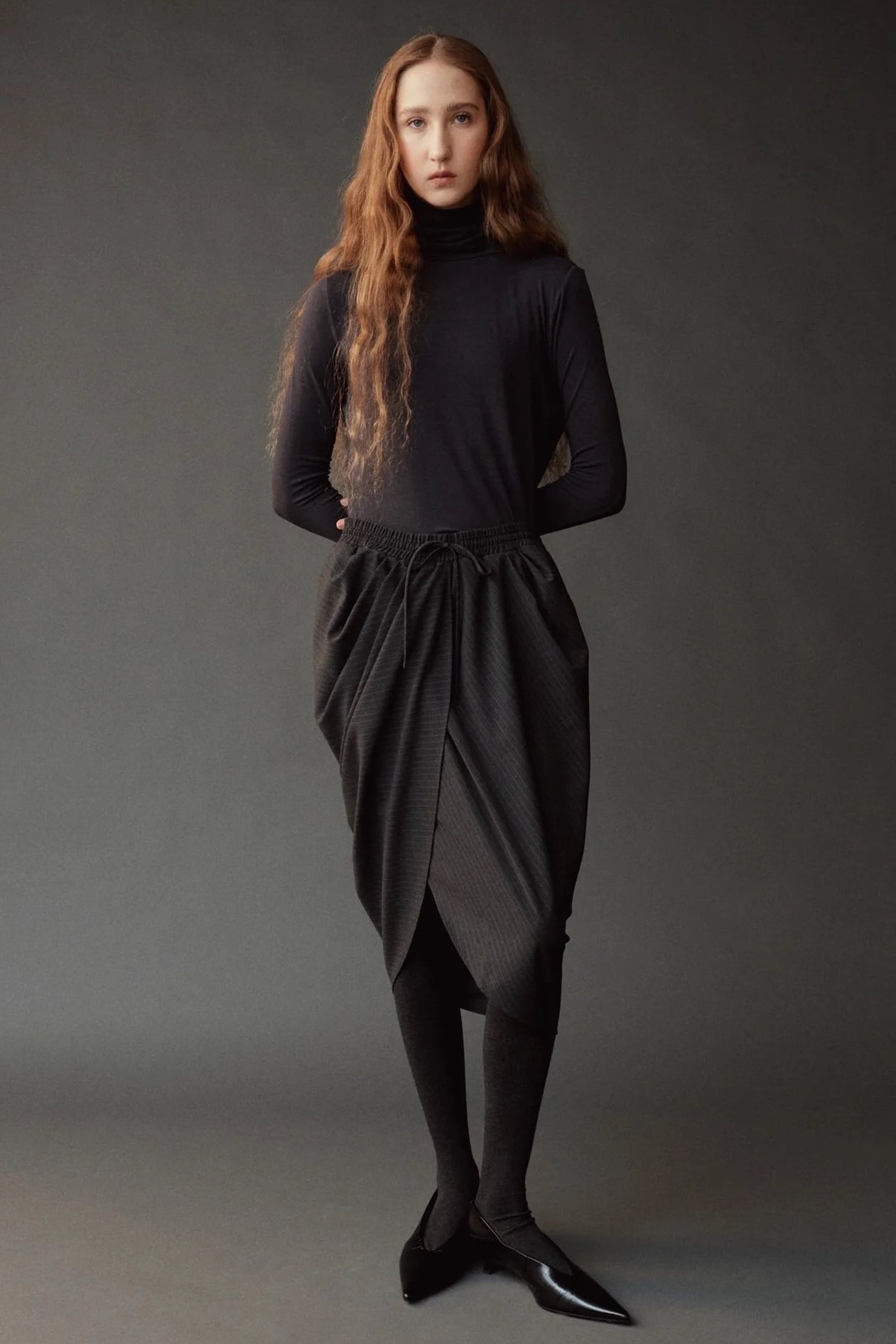 Front view of the graphite roll neck jersey top at SHOP YUCCA in Denver.