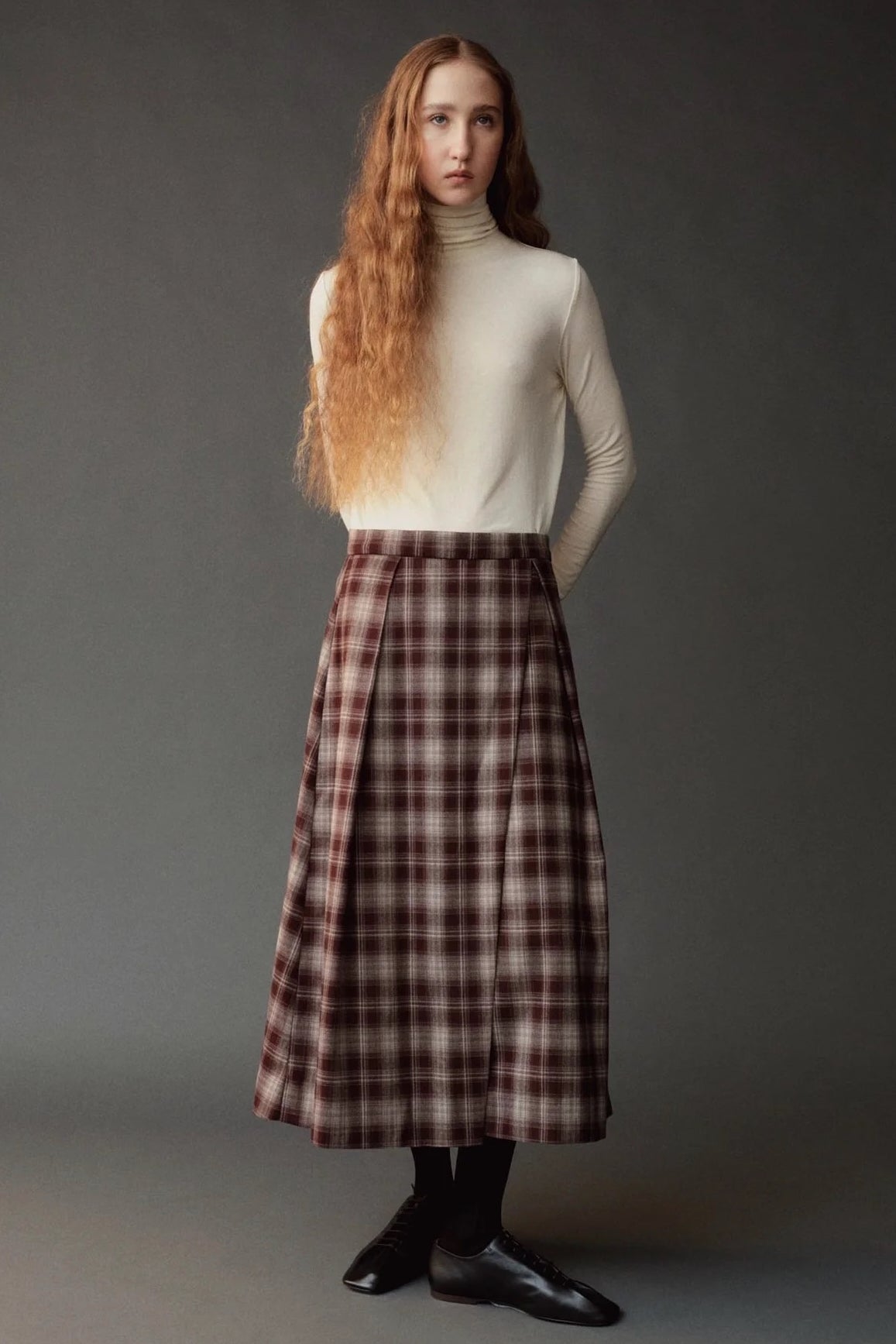 Front view of the ivory roll neck jersey top styled at SHOP YUCCA in Denver.