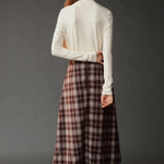 Back view of the ivory roll neck jersey top with long sleeves and a slim fit.