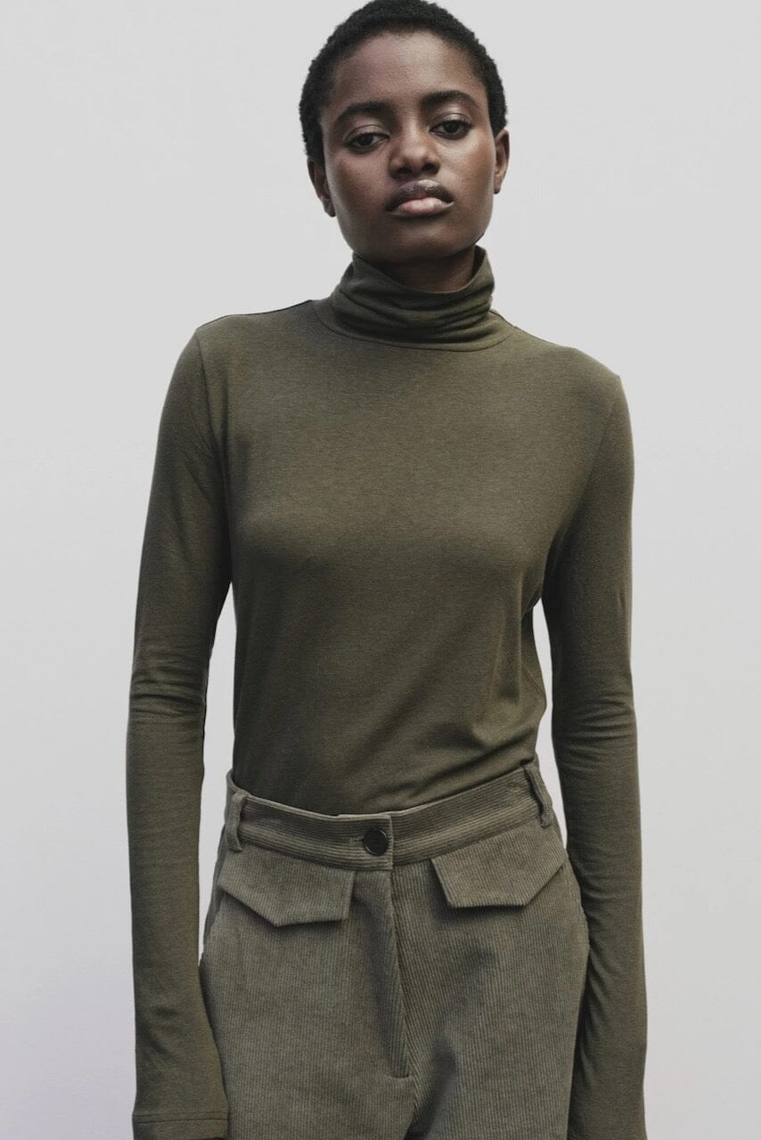 Light olive slim fit roll neck jersey top in stretch knit by Mijeong Park