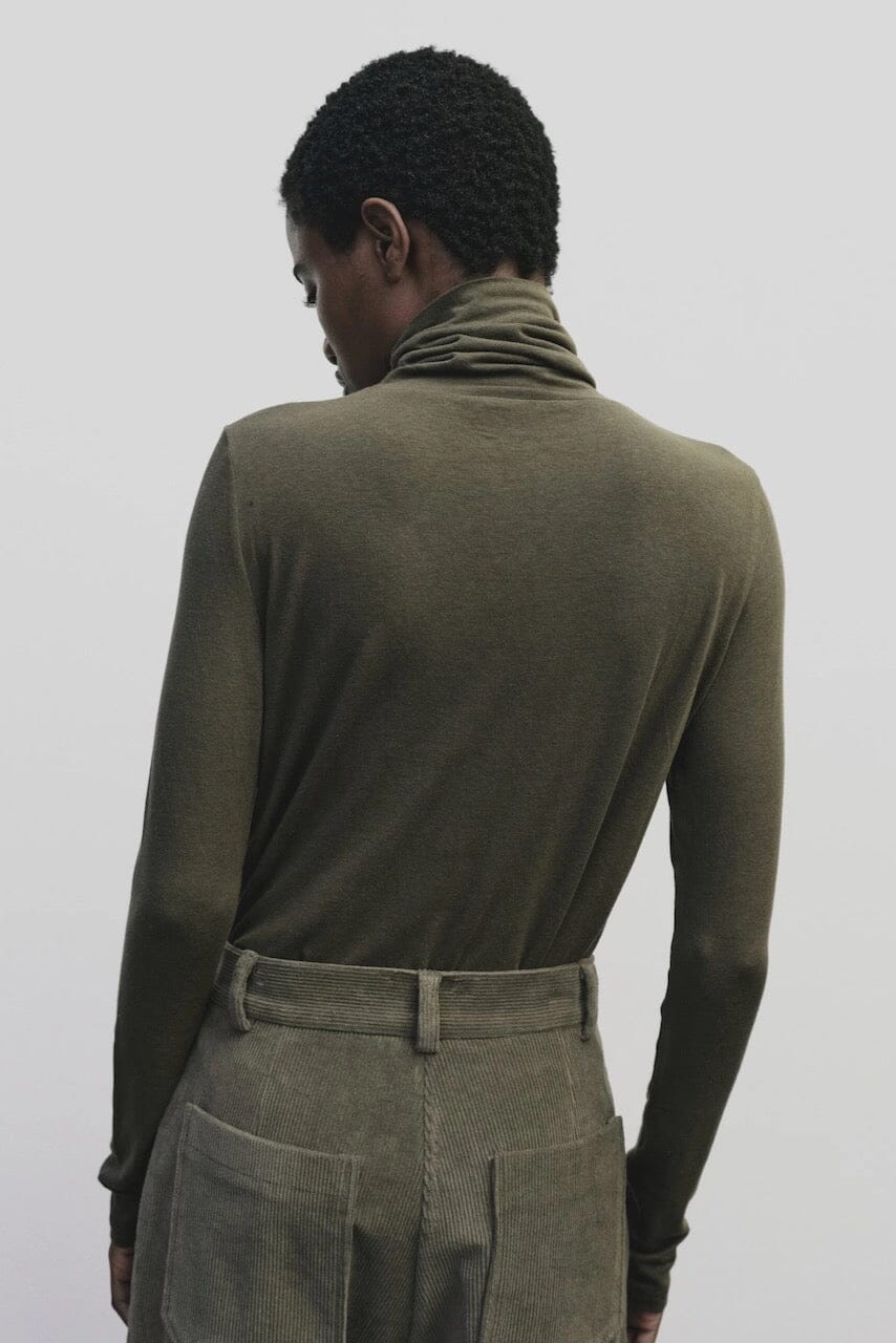 Light olive slim fit roll neck jersey top in stretch knit by Mijeong Park