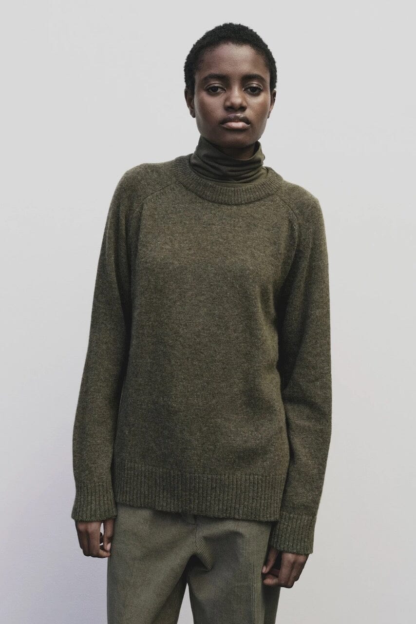 Light olive slim fit roll neck jersey top in stretch knit by Mijeong Park