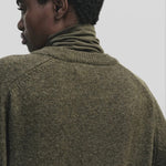 Light olive slim fit roll neck jersey top in stretch knit by Mijeong Park