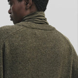 Light olive slim fit roll neck jersey top in stretch knit by Mijeong Park