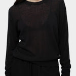 Detail of semi sheer black linen blend knit top by Mijeong Park showing lightweight sheer knit texture