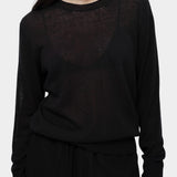 Detail of semi sheer black linen blend knit top by Mijeong Park showing lightweight sheer knit texture