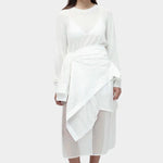 Semi sheer linen blend knit top in white by Mijeong Park, lightweight crewneck sweater with relaxed fit, styled over sheer skirt