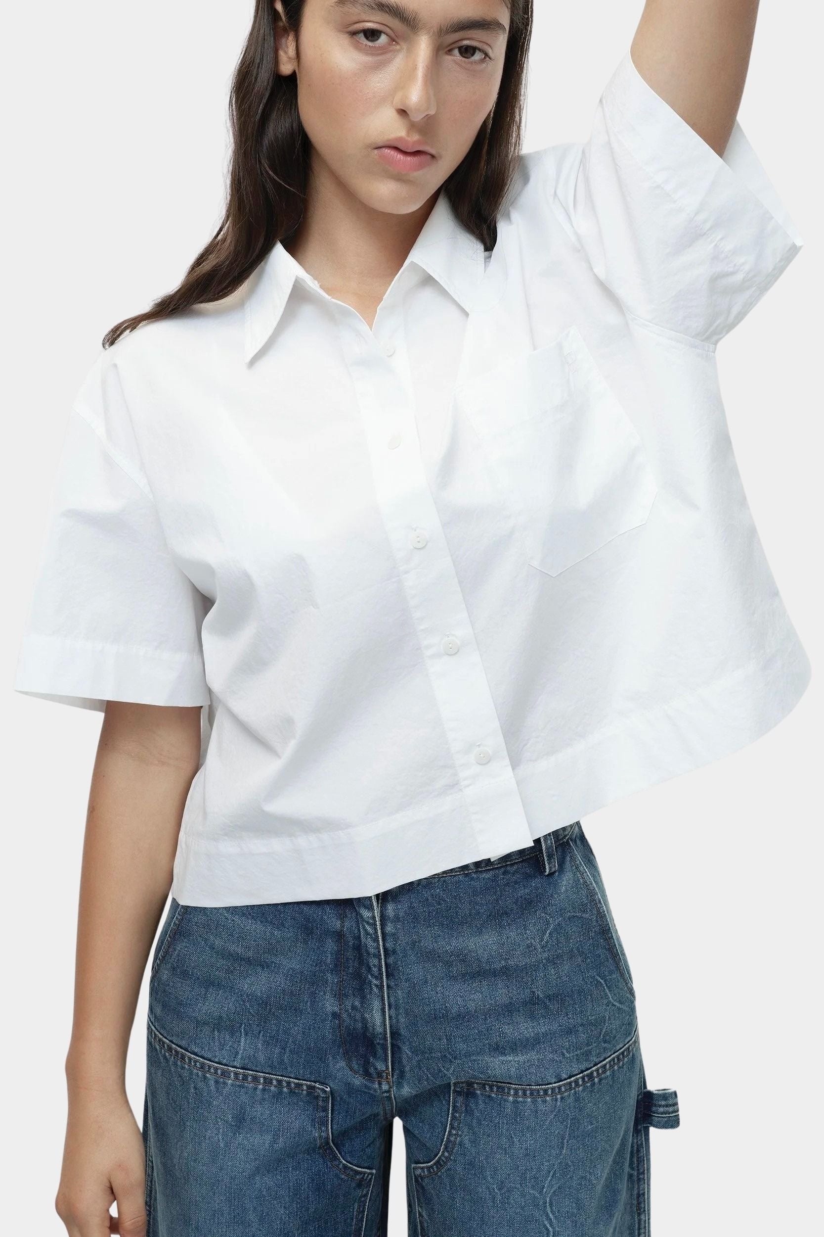 White cropped cotton poplin short sleeve shirt with oversized fit and chest pocket