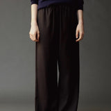 Close front view of the Mijeong Park Wool Blend Drawstring Pants showing the elastic waist and tie