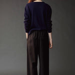 Back view of the Mijeong Park Wool Blend Drawstring Pants in black at SHOP YUCCA in Denver