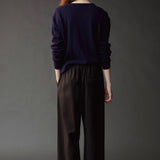 Back view of the Mijeong Park Wool Blend Drawstring Pants in black at SHOP YUCCA in Denver