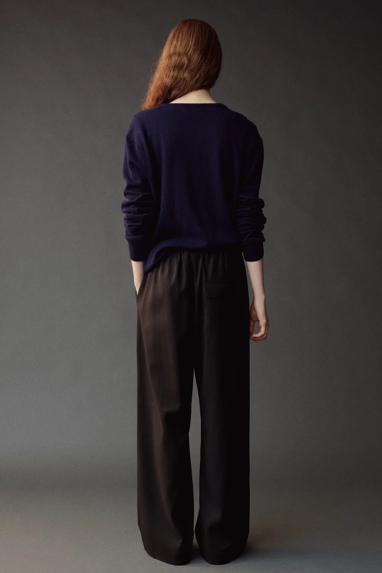 Back view of the Mijeong Park Wool Blend Drawstring Pants in black at SHOP YUCCA in Denver