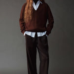 Front view of the Mijeong Park Wool Blend Drawstring Pants in black with a relaxed wide leg