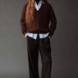 Front view of the Mijeong Park Wool Blend Drawstring Pants in black with a relaxed wide leg