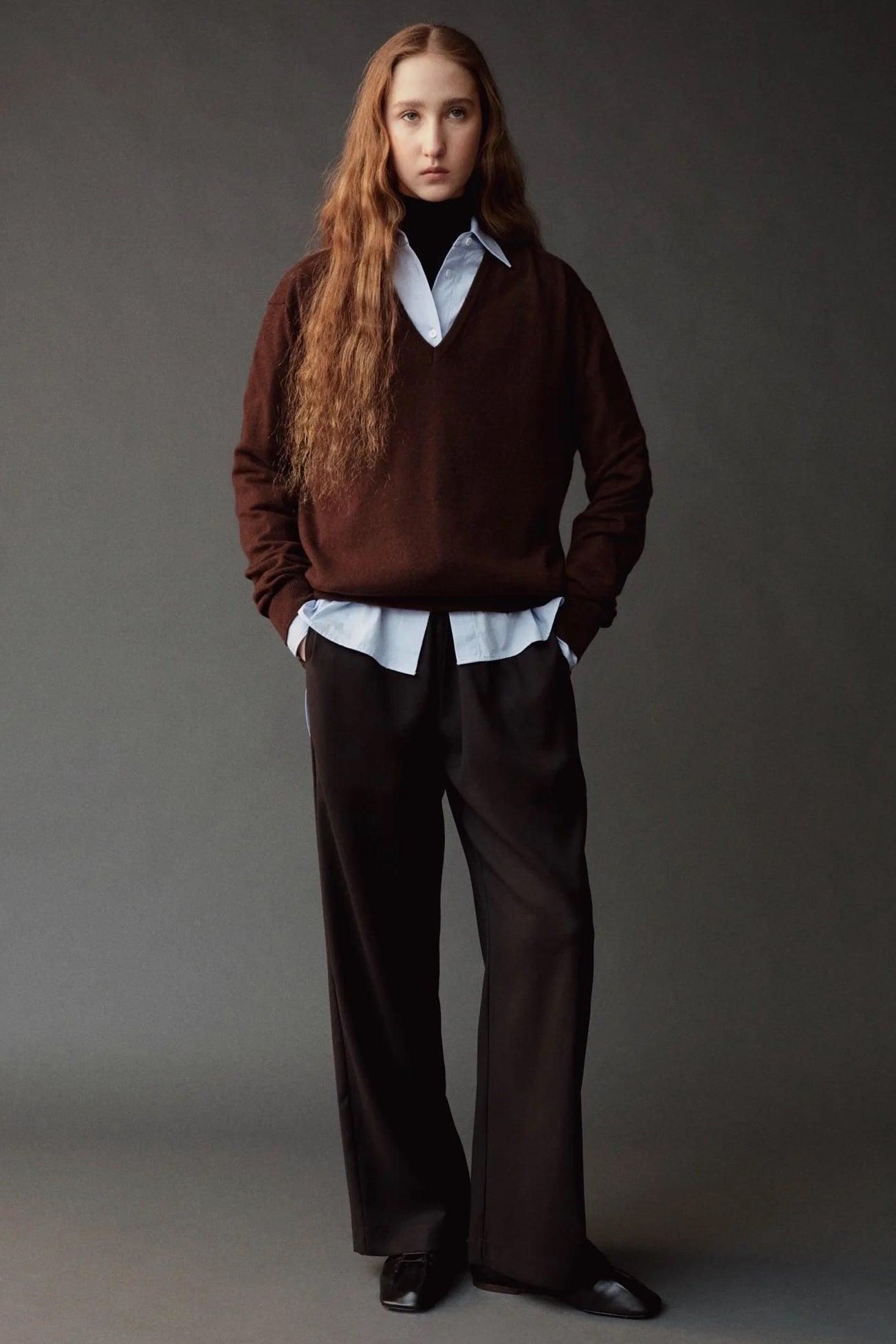 Front view of the Mijeong Park Wool Blend Drawstring Pants in black with a relaxed wide leg