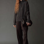 Mijeong Park Wool Blend Drawstring Pants in black styled with a charcoal sweater and leather bag