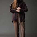 Front view of the Mijeong Park Wool Blend Drawstring Pants styled with a dark plaid shirt