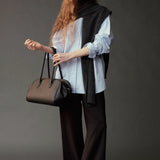 Mijeong Park Wool Blend Knit Shawl Charcoal draped over blue shirt with black trousers