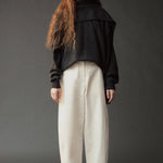 Mijeong Park Wool Blend Knit Shawl Charcoal layered over dark sweater and ivory trousers
