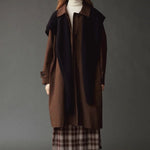 Mijeong Park Wool Blend Knit Shawl Navy layered over brown coat and plaid skirt at YUCCA Denver