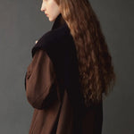 Mijeong Park Wool Blend Knit Shawl Navy worn over shoulders with brown coat, side view