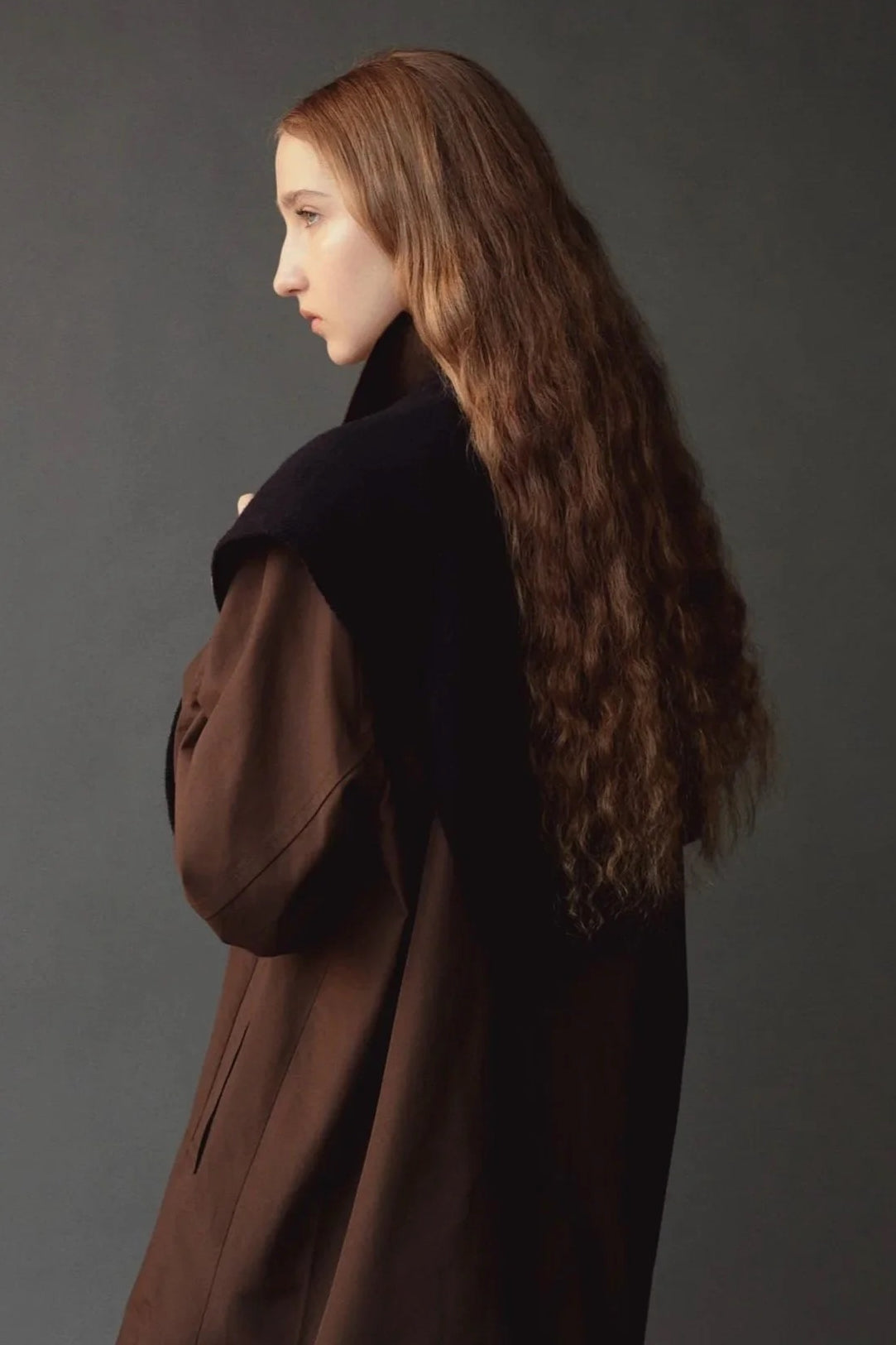 Mijeong Park Wool Blend Knit Shawl Navy worn over shoulders with brown coat, side view