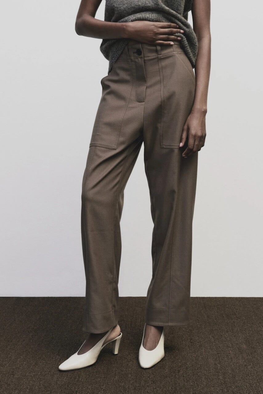 Light brown wool blend workwear trousers by Mijeong Park