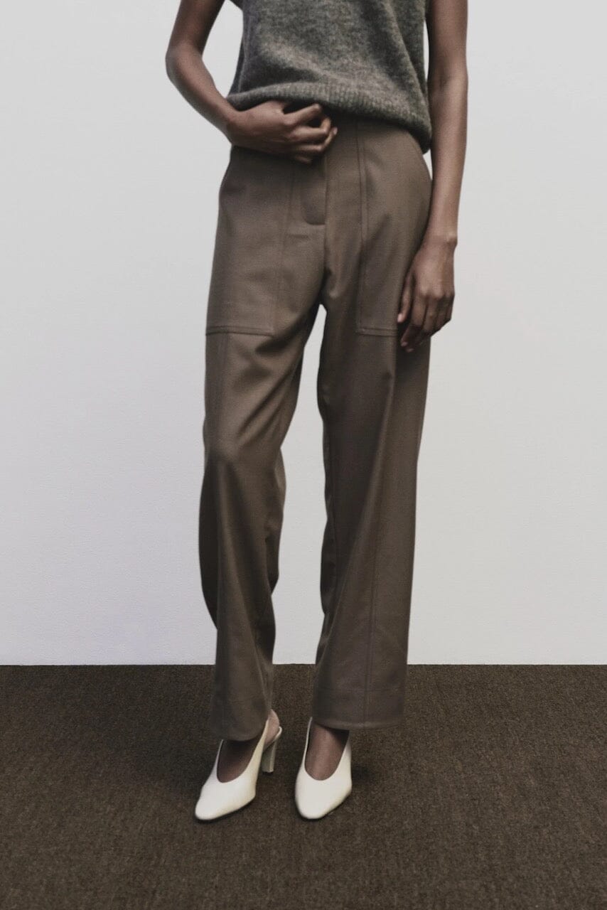 Light brown wool blend workwear trousers by Mijeong Park