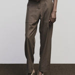 Light brown wool blend workwear trousers by Mijeong Park