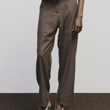 Light brown wool blend workwear trousers by Mijeong Park