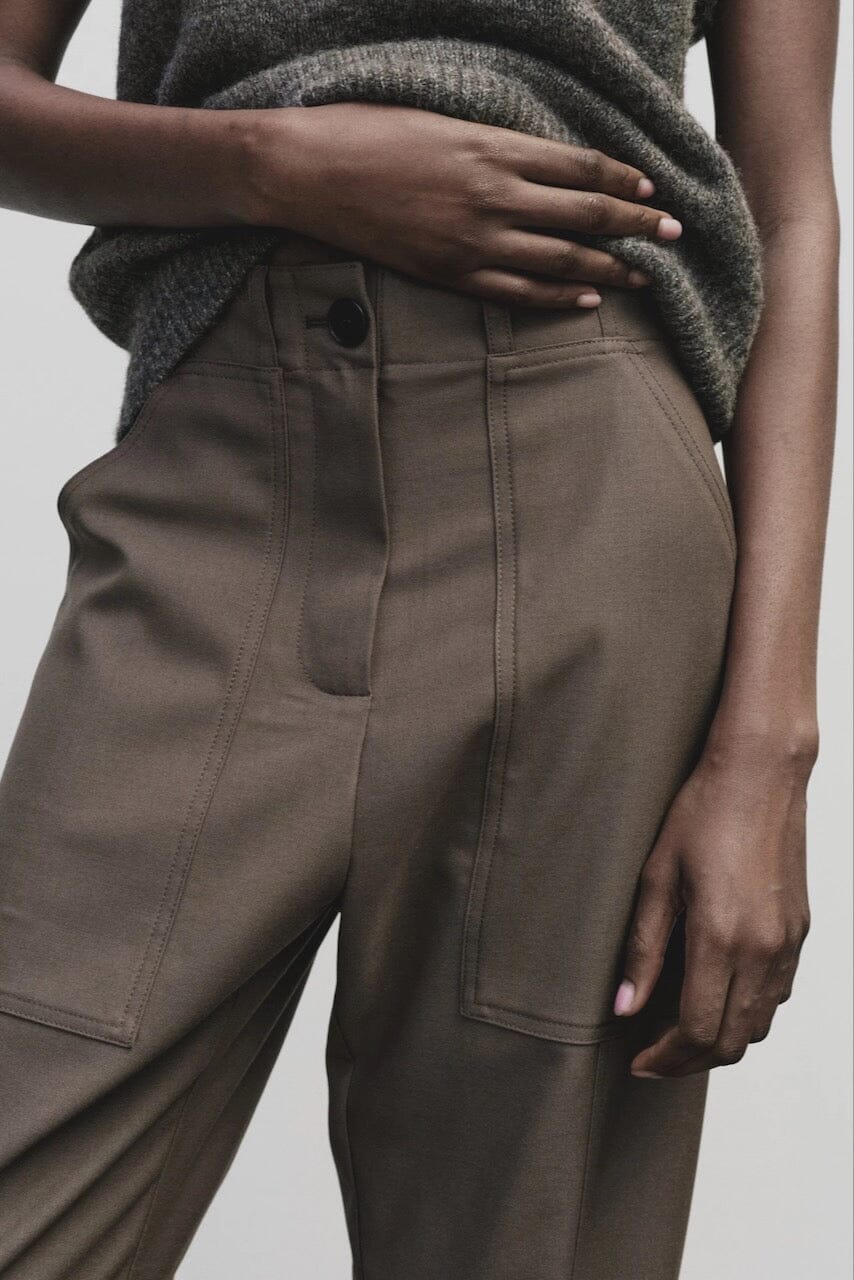 Light brown wool blend workwear trousers by Mijeong Park