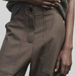 Light brown wool blend workwear trousers by Mijeong Park