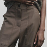 Light brown wool blend workwear trousers by Mijeong Park