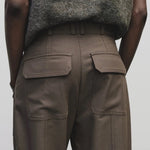 Light brown wool blend workwear trousers by Mijeong Park