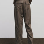 Light brown wool blend workwear trousers by Mijeong Park