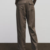 Light brown wool blend workwear trousers by Mijeong Park