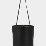Front view of the Modern Weaving Drape Oval Bucket in black with long shoulder straps