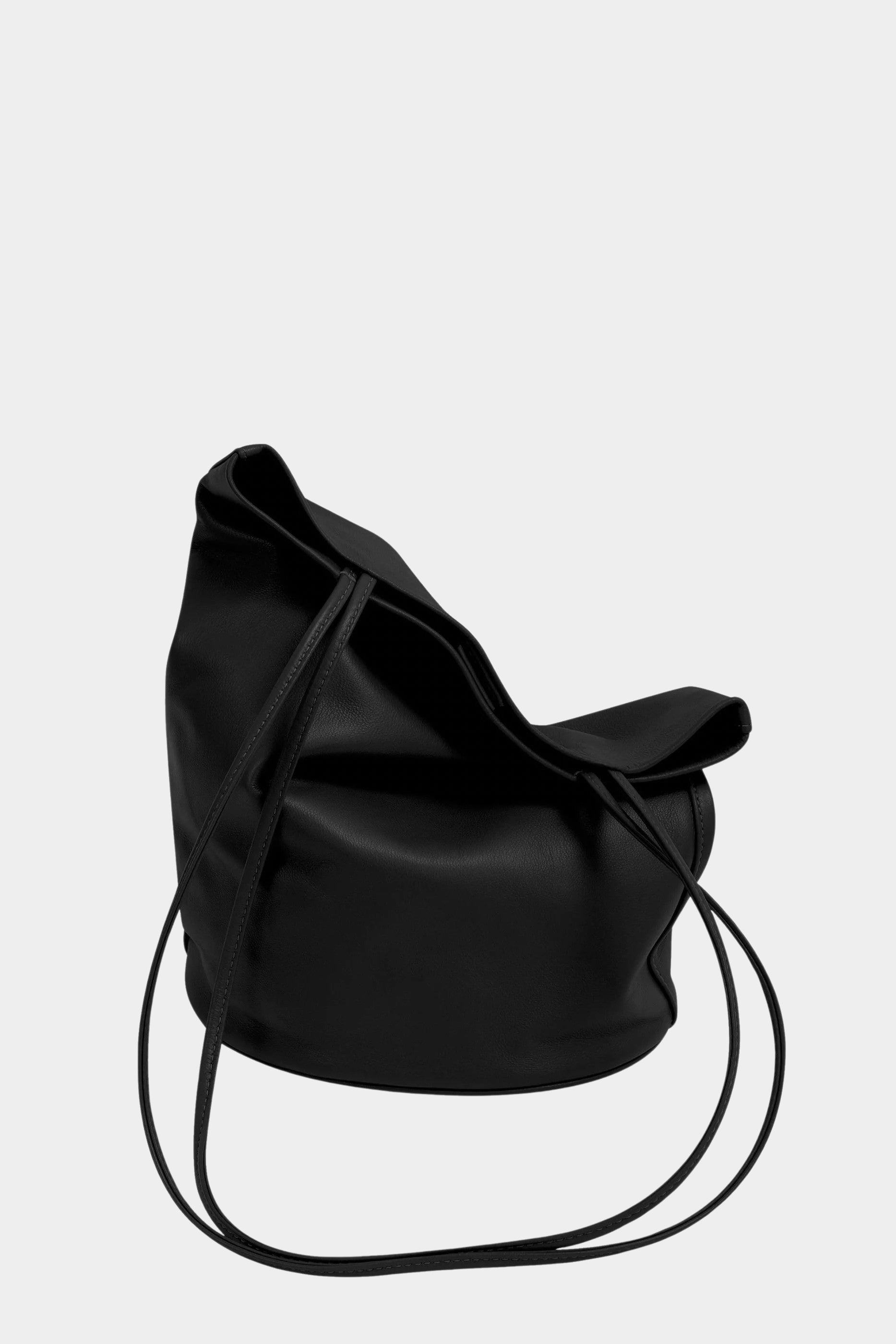 Soft black leather Drape Oval Bucket resting on its oval base with the top draped inward