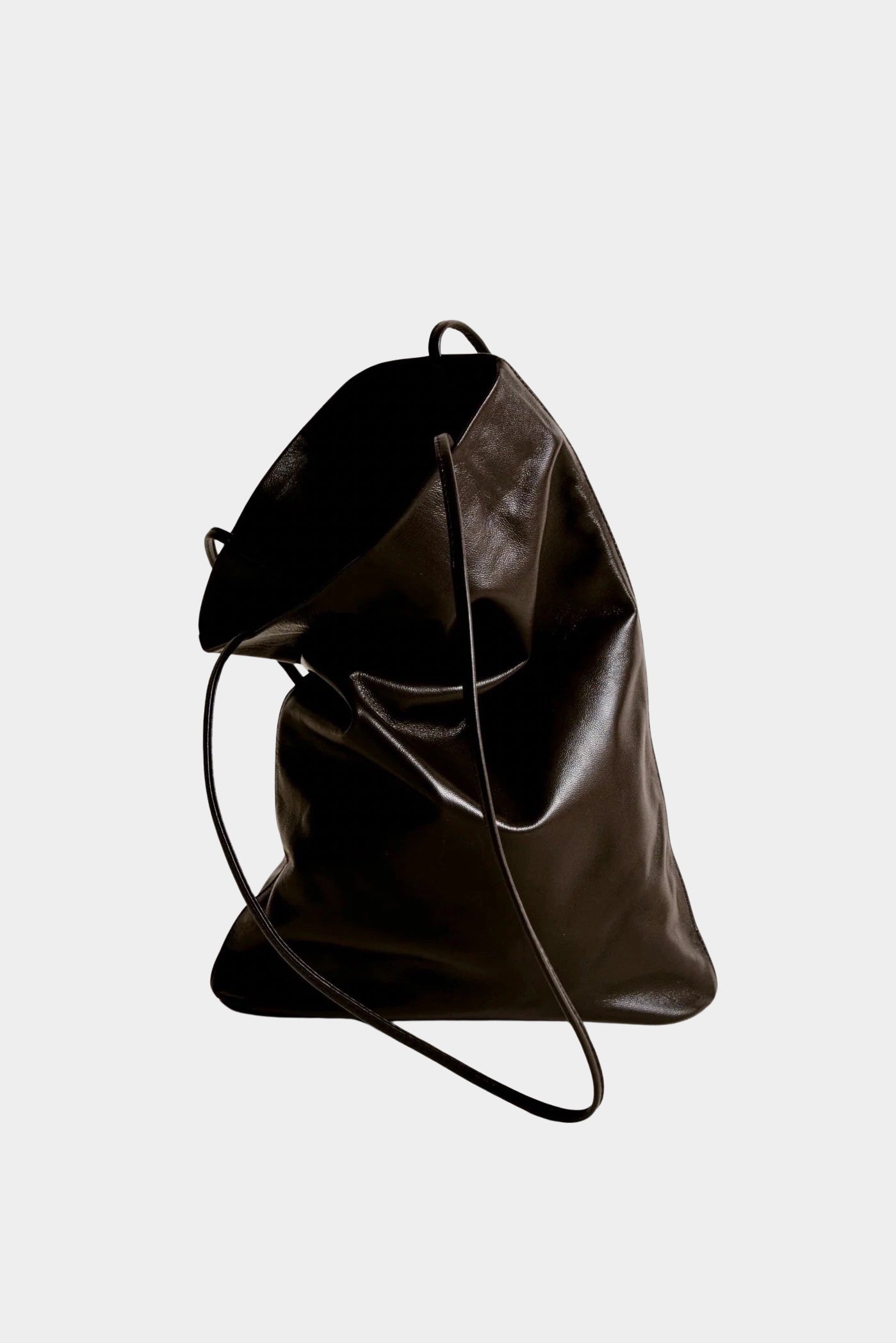 Modern Weaving Slim Elongated Tote in Braun leather with a softly folded shape and slender straps, at YUCCA Denver.