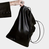 Modern Weaving Slim Elongated Tote Black in Italian lamb leather with soft structure and long shoulder straps