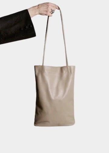 Modern Weaving | Slim Elongated Tote In Taupe - SHOP YUCCA Handbags MODERN WEAVING - YUCCA, Women’s clothing store Denver, women’s high quality bags, women’s online leather bags, minimalist leather bags.