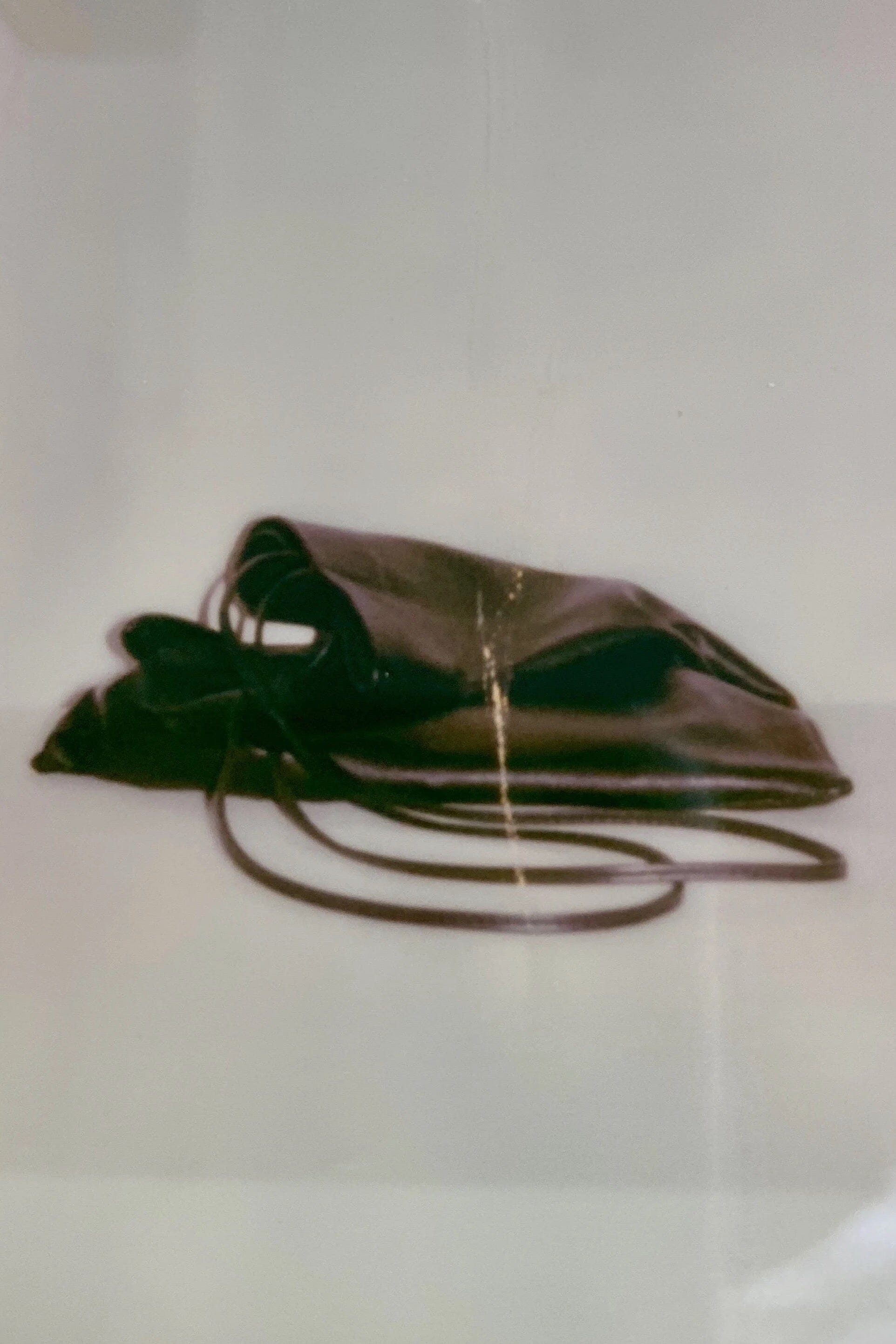 Modern Weaving Slim Lamb Sak Black side view showing slim profile and soft drape