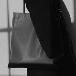 Modern Weaving Slim Lamb Sak Black styled with outfit showing everyday shoulder carry and minimal design