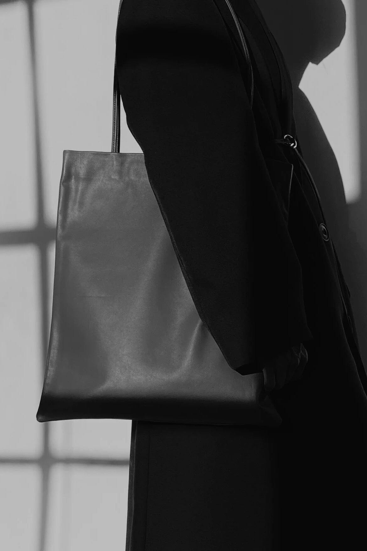 Modern Weaving Slim Lamb Sak Black styled with outfit showing everyday shoulder carry and minimal design