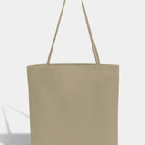 Modern Weaving | Slim Lamb Sak In Taupe - SHOP YUCCA Handbags MODERN WEAVING - YUCCA, Women’s clothing store Denver, women’s high quality bags, women’s online leather bags, minimalist leather bags.