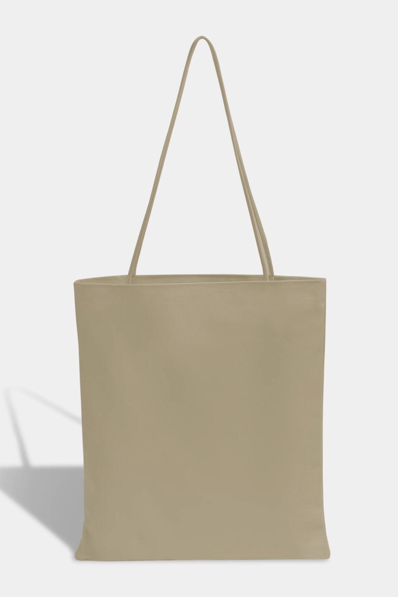 Modern Weaving | Slim Lamb Sak In Taupe - SHOP YUCCA Handbags MODERN WEAVING - YUCCA, Women’s clothing store Denver, women’s high quality bags, women’s online leather bags, minimalist leather bags.