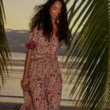 Natalie Martin Bella Skirt Wildflower Spice lifestyle image with floral maxi skirt and soft drape at the beach